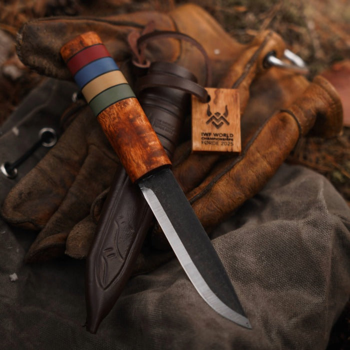 Viking Knife with wooden handle and leather sheath on a textured surface
